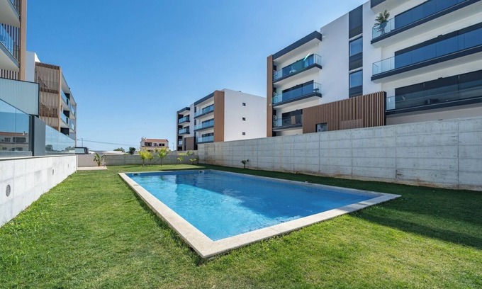 Penina Apartment | Elegant Retreat with Pool and Terrace by HostWise