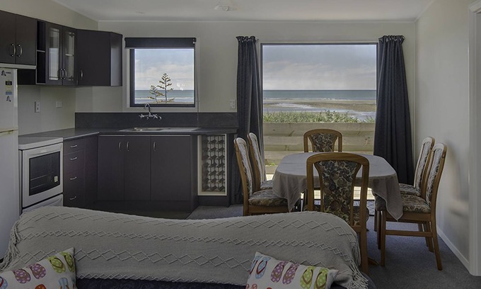 Tasman Cabin | Escape to the tranquil Helme Holiday Bottom Bach, kiwi charm on beautiful Kina Peninsula