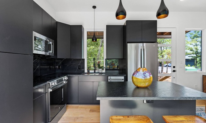 Young Harris Apartment | Escape to this modern 1BR/1BA tiny home in the North Georgia mountains. Enjoy a full kitchen, spa-style rain shower, and private deck surrounded by crisp air and changing leaves. Perfect for cozy autumn nights and mountain adventures.