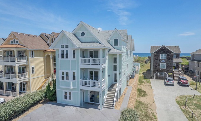 Kill Devil Hills House | Experience luxury at Seas the Day, a stunning 15-bedroom oceanfront retreat in Kill Devil Hills