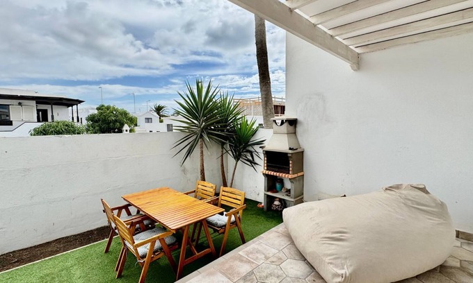 Playa Honda Apartment | Family Palms Retreat: Terrace, BBQ & Beach Bliss! By Bayside Rentals