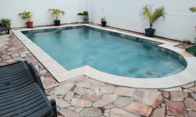 La Riviere Saint-Louis House | Fully equipped room with pool.