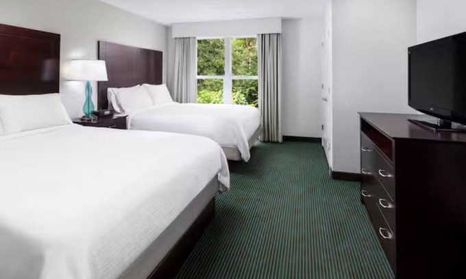 Florida Central Atlantic Coast Hotel | Fun-Filled Resort Getaway l 4 Spacious Suites + Free Breakfast & Park Shuttle