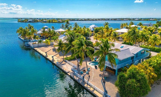 Sugarloaf Shores House | Green Turtle Oasis: Lovely 4BR Canal Front Home, Pool, Dockage, Tiki, Outdoor Dining & Pet Friendly!