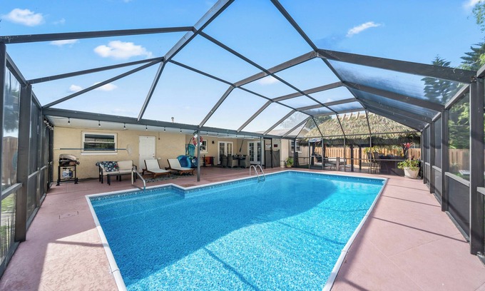 Holiday Cove House | Heated Pool, BBQ Grill, & Tiki Bar near USSSA and Cruise Port Canaveral