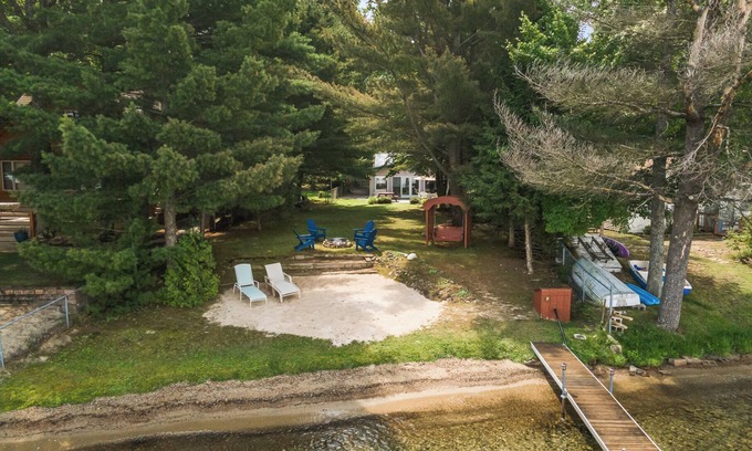 Higgins Lake House | Higgins Lake Private Beachfront Home w/Dock, Boat Mooring, Sunset & Sunrise View
