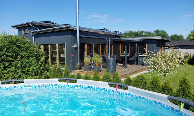 Oberhavel House | Holiday Home 'Happy-Nest' sauna pool air conditioning Wi-Fi fireplace barbecue