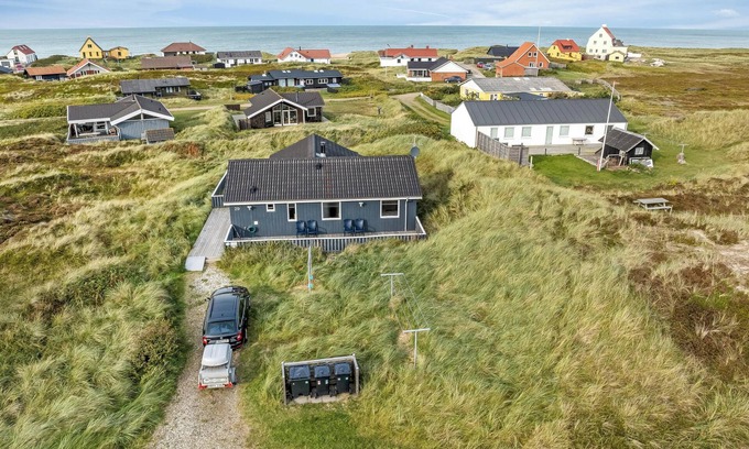 Lild Strand House | Holiday home with spa and sauna, just 200 meters from the North Sea.