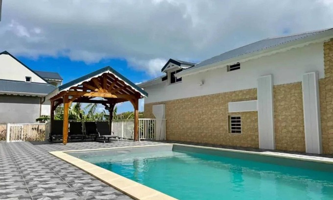 Bas Vent House | Homerez - Family House in Deshaies with Shared Pool
