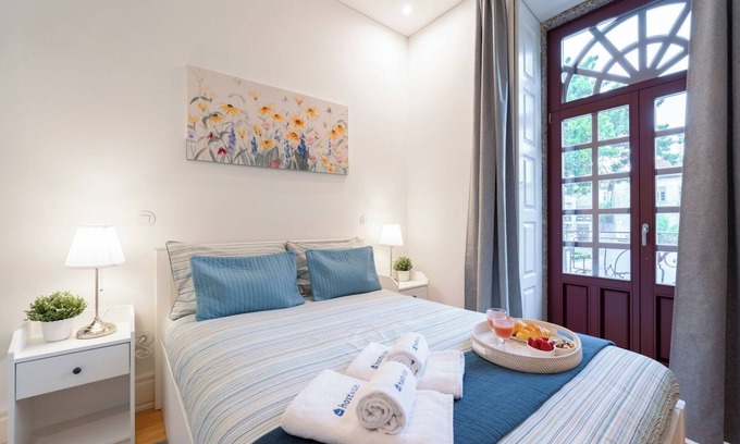 Guimaraes Apartment | HostWise - Bright Flat w/Balcony