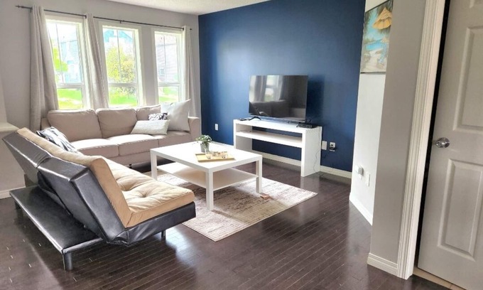 Southeast Edmonton House | House in Summerside with a huge patio and an extra tall garage