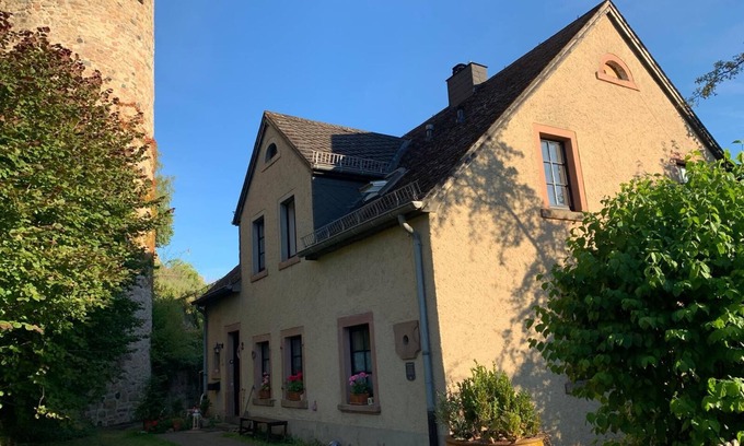 Hillesheim Apartment | Idyllic mill building directly on the city wall with a large garden