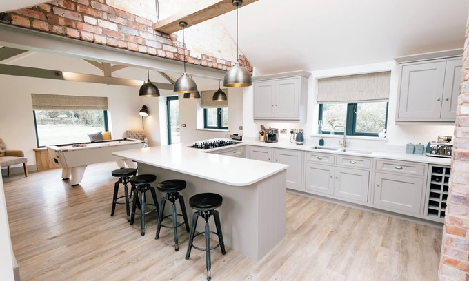 Nantwich House | Imagine relaxing on a spacious corner sofa, wrapped in the warmth of your loved ones, as the gentle crackle of a log burner fills the room. Picture yourself unwinding in a hot tub at sunset, drink in hand, with the stresses of the week melting away.