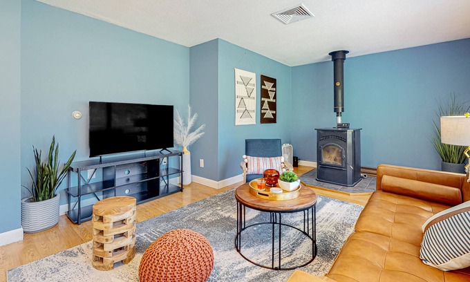 Barnstead House | Inviting riverfront home with pool, kayaks, firepit, & W/D