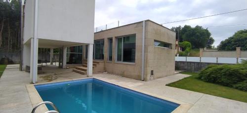 Tomino House | La casa de Cristal