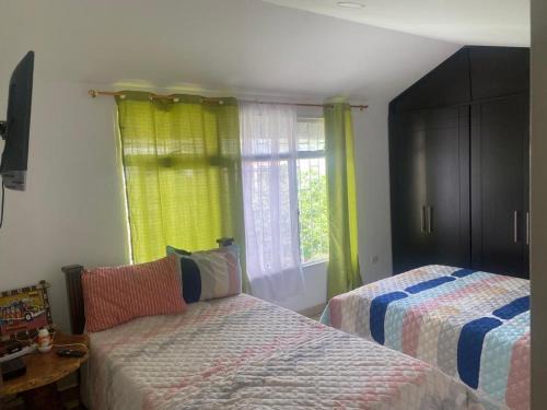 Calarca House | La Posada de Laura - Habitación