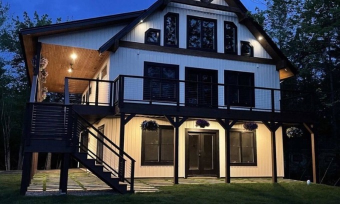 Lochmere House | Lake Winnisquam. Large family lake view home with beach access. Sleeps 16.