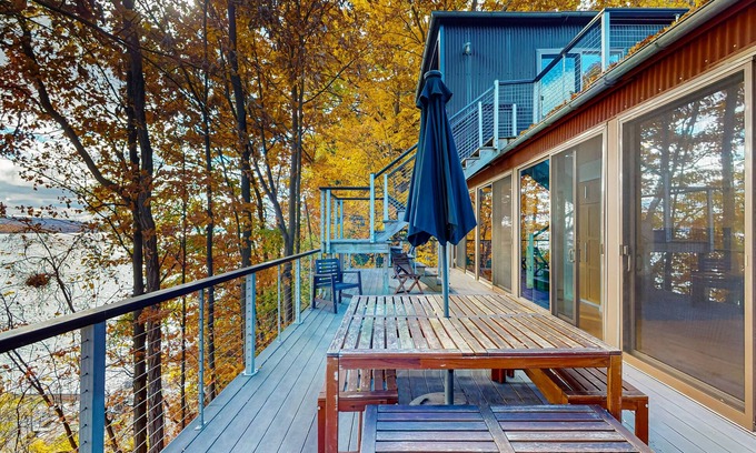 Valois House | Lakefront contemporary gem with decks, lake views & pebble beach