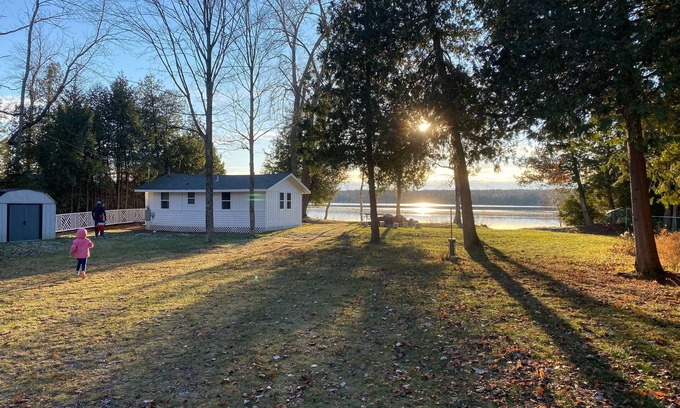Baileys Harbor Cottage | Lakefront Cottage Retreat w/Private Dock, Paddle Boards, Fire Pit, Sunset Views