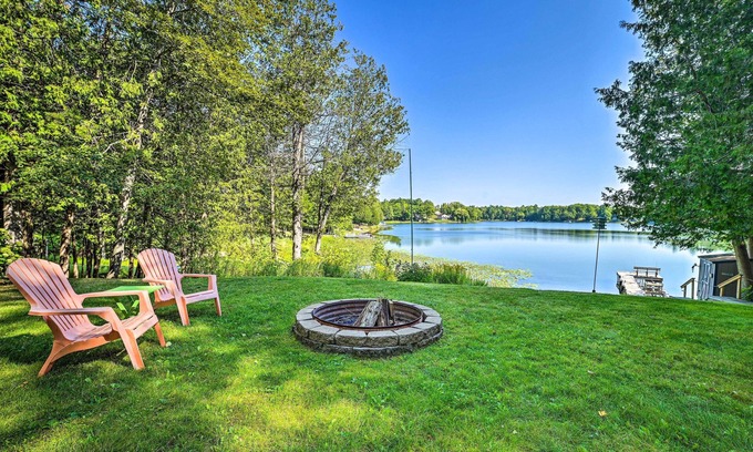 Curtis Township Cottage | Lakefront Hideaway w/Dock, Kayaks, Fire Pit!