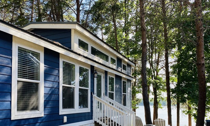 Steele Creek Cabin | Lakefront Two Bedroom Tiny Home #15 on the lake at Long Cove Resort by RedAwning