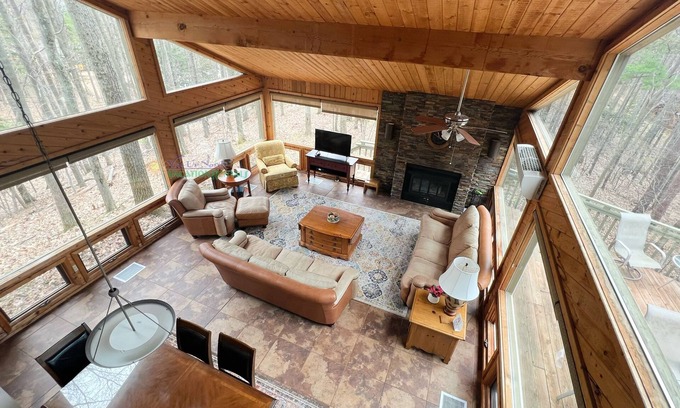 Maple City Cabin | Lodge-style multi-level home at the Homestead in Glen Arbor. Deck with grill.