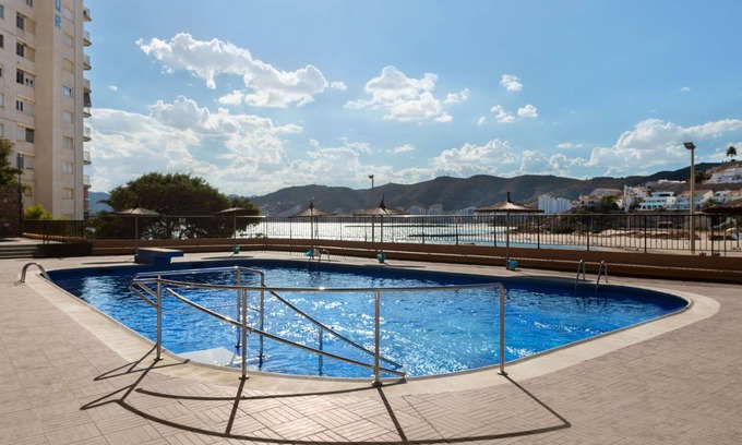 Faro de Cullera Apartment | Lovely apartment for 4 guests with pool, WIFI, TV and balcony