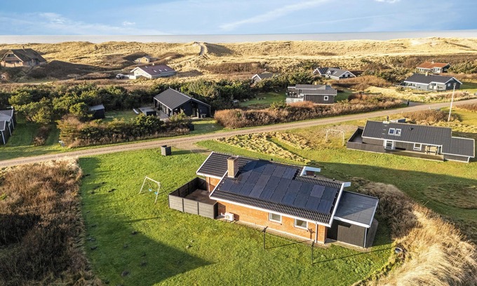 Harboore House | Lovely holiday home with pool, spa and sauna, only 200 meters from the North Sea.