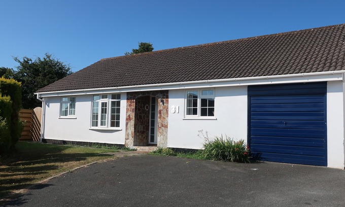 Wadebridge House | Lovely sunny bungalow near Rock, large secure garden, EV Charger on driveway