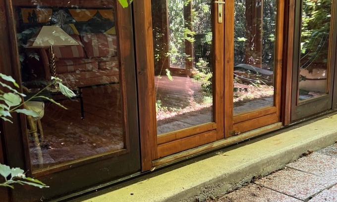 San Martino in Rio Cottage | Lovely wooden accommodation surrounded by greenery