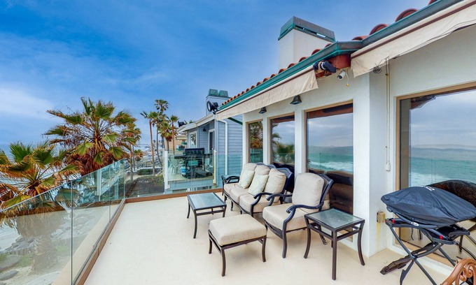 South Oceanside House | Luxury Beachfront Getaway: Stylish Home with Balcony, Firepit & Ocean Views