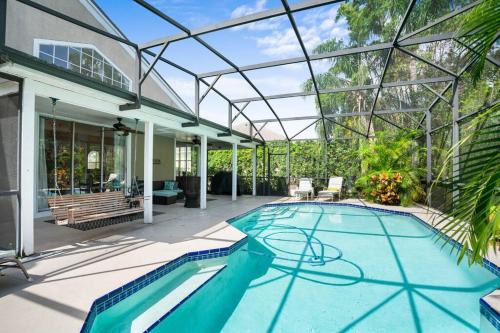Metro West House | Luxury Home by Disney World & Heated Pool & Movie Room