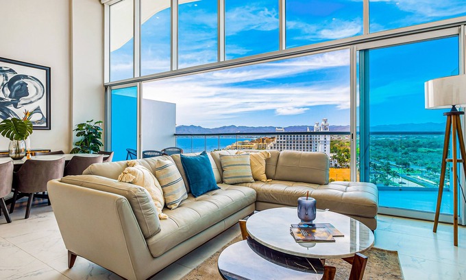 Flamingos Condo | Luxury ocean-view condo with resort pool, private balcony, and washer/dryer