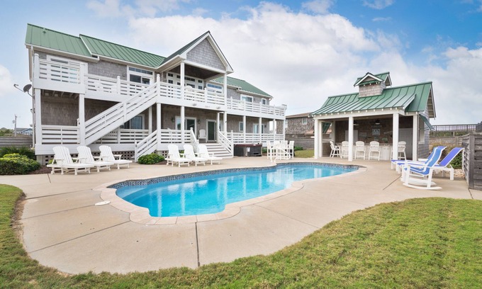 Southern Shores House | Luxury Southern Shores home with Private Pool, Hot Tub with Pool Bar, Game Room, and Theatre Room