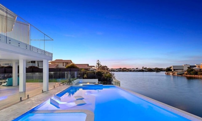 Pelican Waters House | Luxury Waterfront Resort Style Pool, Spa & Firepit