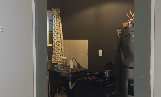 Cancun House | MiniHouse in front of park with parking.