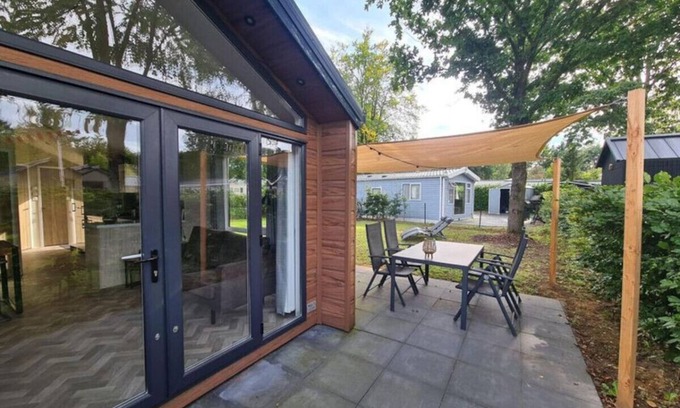 Municipality of Epe Apartment | Modern chalet retreat with spacious garden in the Veluwe.
