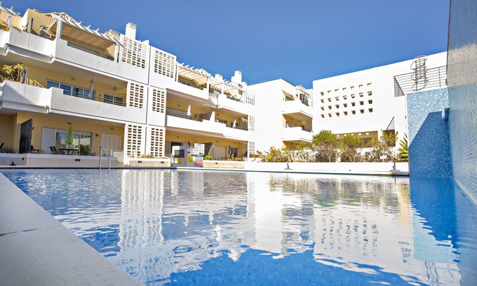 Cabanas Apartment | Modern, cozy apt with pool access