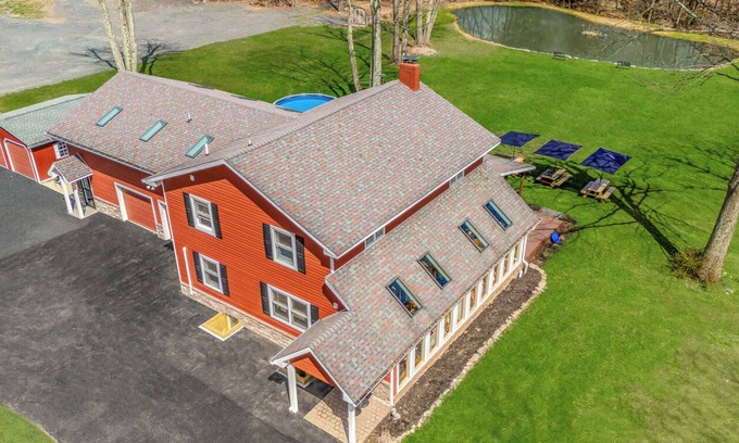 Canadensis House | Modern Farmhouse w/heated pool, hot tub, fishing pond, movie theater, game room