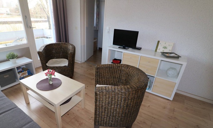 Horumersiel Apartment | Modernized holiday apartment with a view from the balcony of the idyllic Horum low