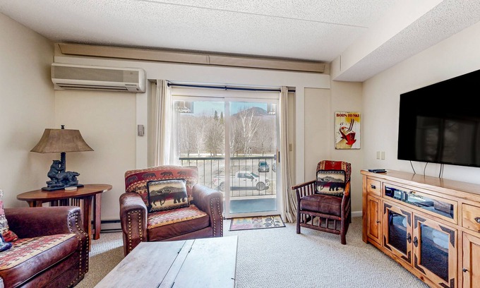 Lincoln Condo | Mountain & river view condo w/pool, hot tub, game room & walk to ski lift