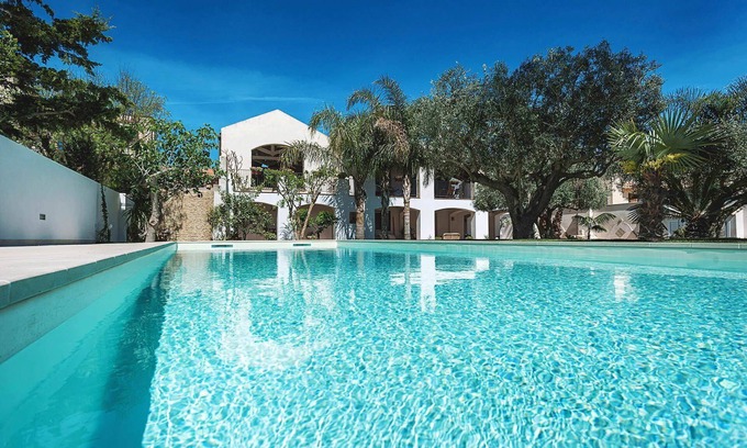 Marsala House | My Rental Homes - Casa Tika with shared pool surrounded by a wonderful garden