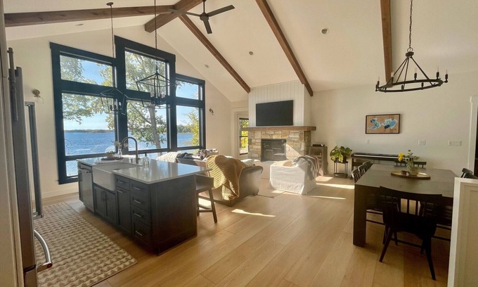 Aitkin House | New, stunning modern lake home with private swimming beach and dock