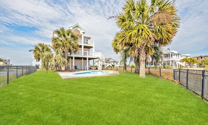 Sunset Beach Cottage | Newly redecorated ocean views, 3 stop elevator, swimming pool deep water canal.