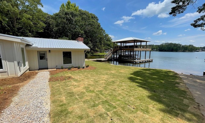 Dadeville Cabin | Newly renovated lakefront cabin at Lake Martin! Dock and boat ramp onsite!