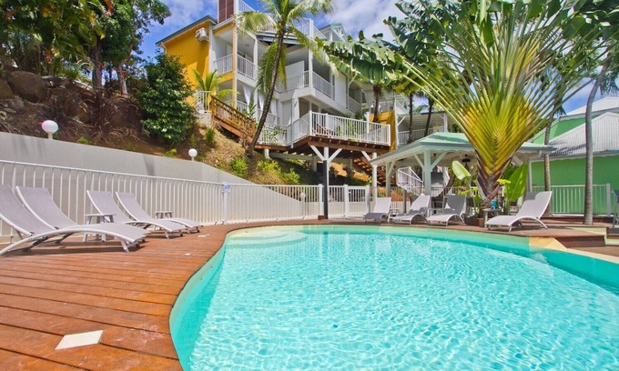 Deshaies Apartment | "O Coeur de Deshaies", Papaya Duplex. Room with sea view. A/C, swimming pool.