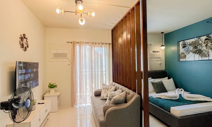Puerto Princesa City Centre Apartment | Ocean Studio1 Bedroom, Private Balcony, Inviting Pool, and Gym