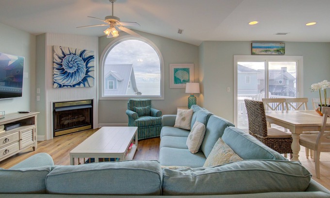 Village of Stump Sound House | Ocean-view 2-story home with fireplace, community outdoor pool & tennis court