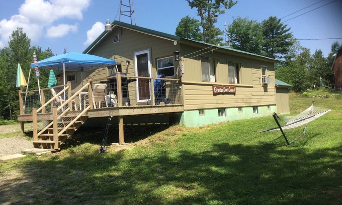 North New Portland Cottage | Paddle, float, fish, or rope swing into the near by crystal clear mountain lake.