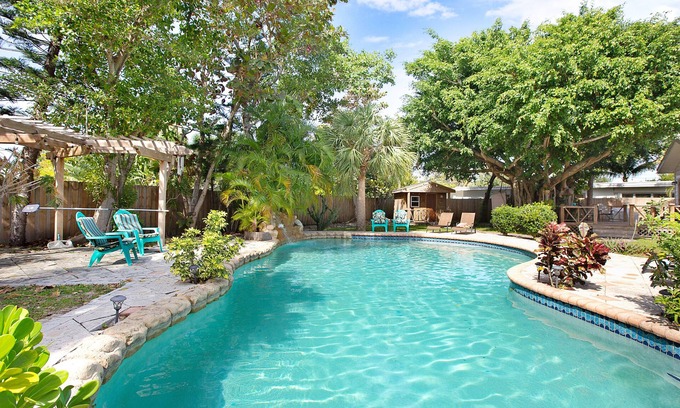 Parrot Cove House | Palmway Tropical Oasis - Heated Pool, Beach & Golf